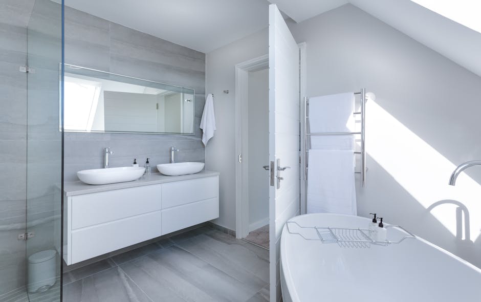 pexels-photo-1454804-1454804 Sleek contemporary bathroom with bathtub and twin sinks, showcasing minimalist design and luxury.